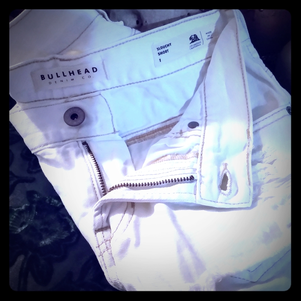 White distressed shorts